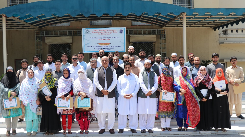 The registrar, University of Peshawar  Dr. Zahid Gul posing with a group of 40 participants at the concluding session of two-day workshop entitled as 